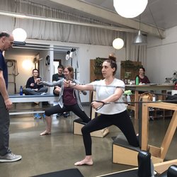The Reformation Station - Teacher training! Marina and Julianna are practicing on the Pilates Arm Chair.