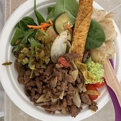 Commissary - Lunch: vegan beef and onions, salad, taquito, cherry tomatoes, my purple spork and a bamboo table knife.