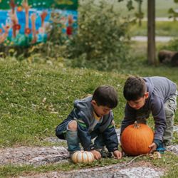 Families Together Cooperative Nursery School - Playing in the beautiful community garden.