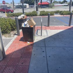Dollar Tree - Trash over flowing , gum all over
