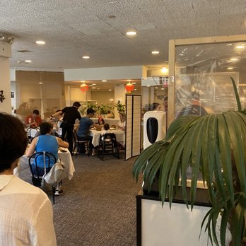 Aberdeen - people sitting at tables in an office setting - Dim Sum Near Me - White Plains, New York
