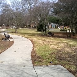 Several benches, some with shade