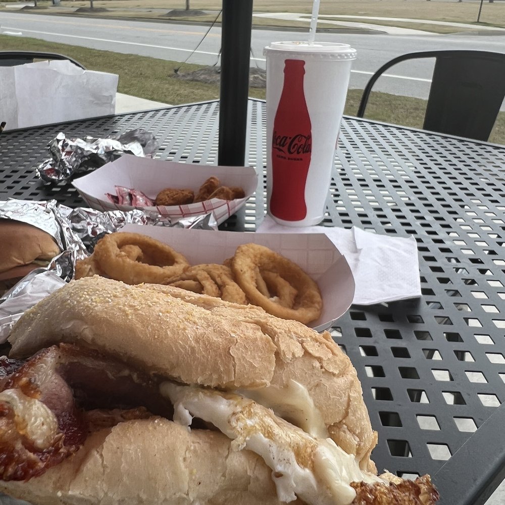 Grand Slam egg sandwich on perfect roll w 2 fried eggs, hash browns, bacon, cheese, and aioli.