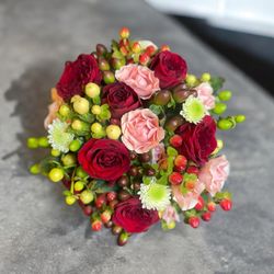 Bud Weismiller Florist and Flower Delivery - The best florist delivery equals our Berry Pie arrangement with red spray roses, pink spray roses, white spray roses, and hypericum berries.
