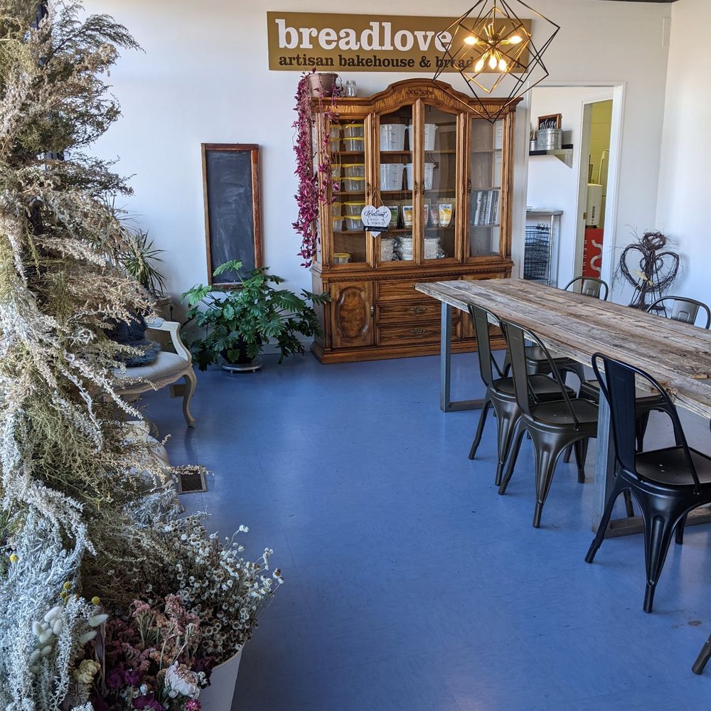 BreadLove - a dining room with a table and chairs - Bakeries Near Me - St Albert, Alberta BreadLove - a dining room with a table and chairs - Bakeries Near Me - St Albert, Alberta