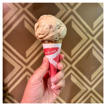 Salt & Straw - a hand holding an ice cream cone - Ice Cream & Frozen Yogurt Near Me - Los Angeles, California