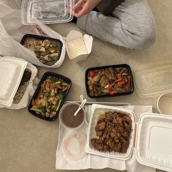 Soong Soong - a woman sitting on the floor with her food - Chinese Near Me - San Jose, California Soong Soong - a woman sitting on the floor with her food - Chinese Near Me - San Jose, California