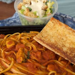 Chicken arabbiata with garlic bread and Caesar salad
