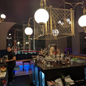 Side Bar - a man behind a bar counter - Cocktail Bars Near Me - Ogden, Utah Side Bar - a man behind a bar counter - Cocktail Bars Near Me - Ogden, Utah