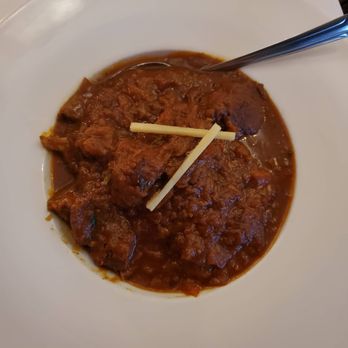 Mantra - Charminar Ki Nali Nihari:  Goat meat cooked in a slow fire with green cardamom gram flour yellow chilli powder and whole Indian spices. - Indian Near Me - Paramus, New Jersey