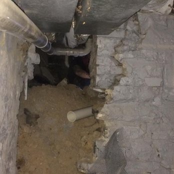 P.B.M. Plumbing - Working in a crawl space to replace a cracked soil pipe - Plumbing Near Me - Buffalo, New York P.B.M. Plumbing - Working in a crawl space to replace a cracked soil pipe - Plumbing Near Me - Buffalo, New York