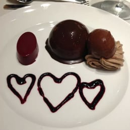 Chocolate three ways with huckleberry sauce.