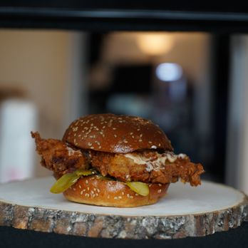 Aloette - a fried chicken sandwich on a plate - Burgers Near Me - Toronto, Ontario