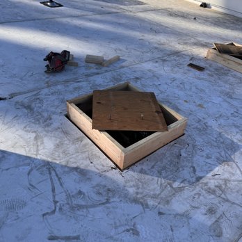 Nash Framing - the roof of a building being built - Carpenters Near Me