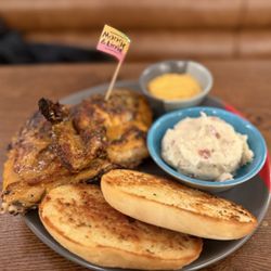 Nando's Peri-Peri - 2 Two 1/4 Chicken Breasts with garlic bread and mashed potatoes