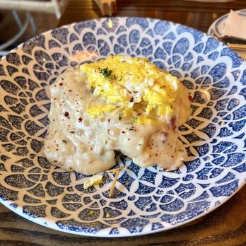 Chef Art Smith's Reunion - Biscuits and gravy with scrambled egg on top. - American Near Me - Chicago, Illinois