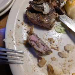 Texas Roadhouse - 16 oz window-selected ribeye steak supposedly cooked "rare" (cold center). This one was "medium-well".