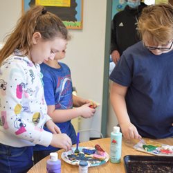 Abundant Life Christian School & Childcare - A girl and a boy painting clay sculptures.