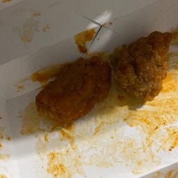 two pieces of fried chicken in a box two pieces of fried chicken in a box