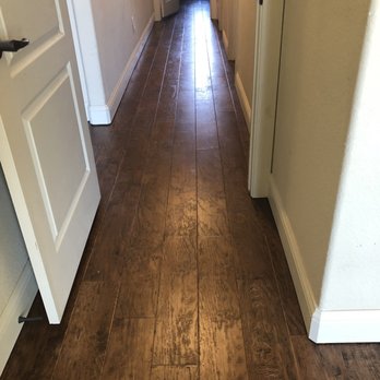 Larry's Carpet - a hallway with a wood floor - Carpeting Near Me - Lakeside, Texas