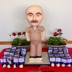Northwest Cakes - 3 foot tall bobblehead cake. The whole structure is edible and surrounded by custom cake pops.