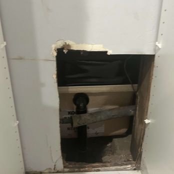 Craig Korin Construction and Plumbing - Here's a photo of the hole left in the closet of the bedroom. You can see the back of the tub and the pipes going to it in the bathroom - General Contractors Near Me