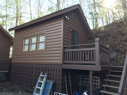 Complete Exterior Painting - This Cabin had a previous Stain which was fading out and was started to hold moisture, leading to mildew.
This project started with an initial bleaching and sanding. After surface was prepped, home was treated to a Full body latex stain. Entire exterior surface of home, small mother in law suite, and deck were completed. Pickets and Rails on deck were also stained.