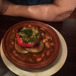 Cafe Mauresque - Tagine - Sweet pepper stuffed with mushrooms and topped with cheese, served with aubergine fritters and butterbeans gravy