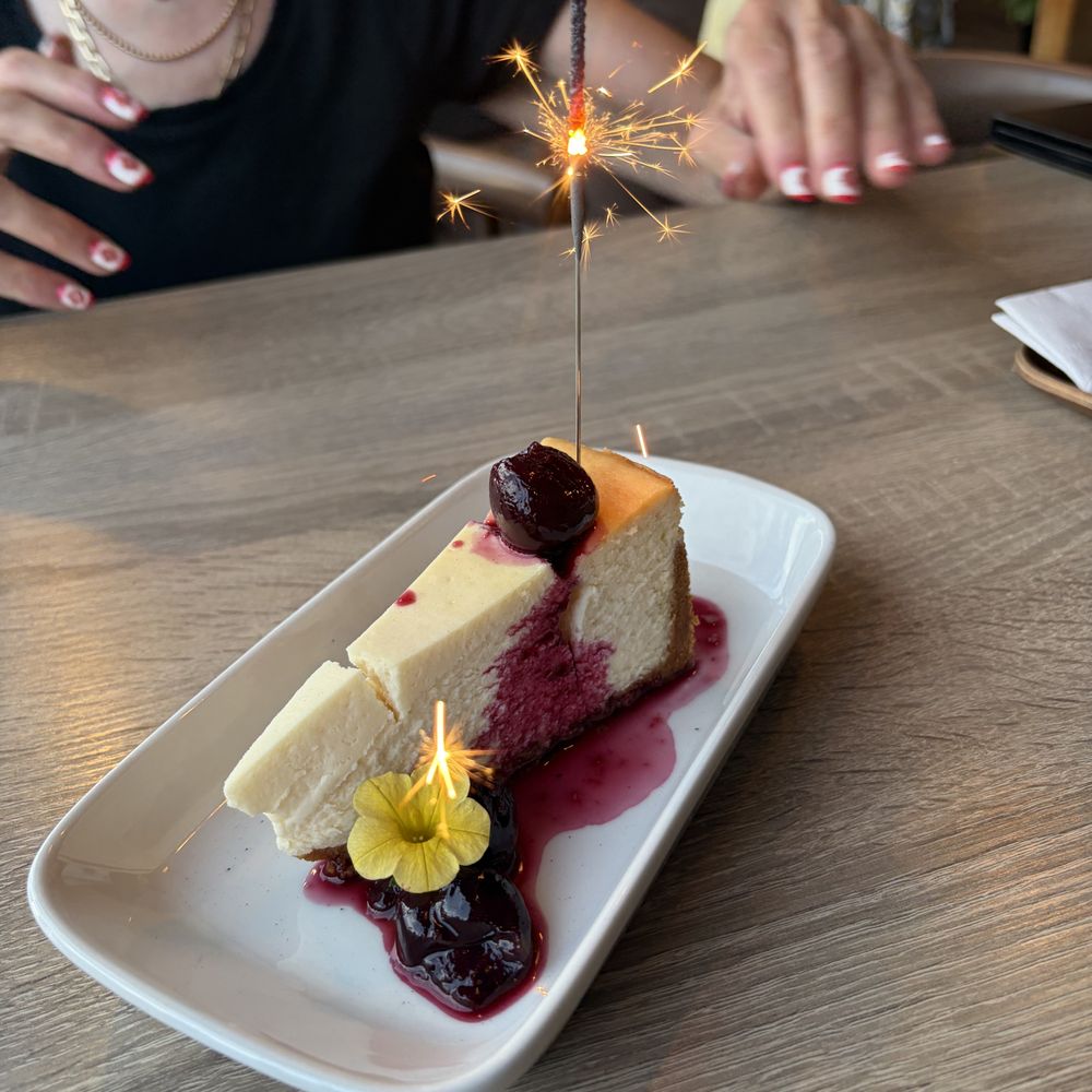 The Kitchen - Cheesecake dessert with sparkler! - Basque Near Me - Penticton, British Columbia The Kitchen - Cheesecake dessert with sparkler! - Basque Near Me - Penticton, British Columbia