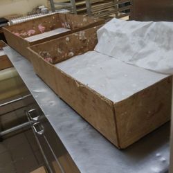 Donut & Donuts - Donut boxes that they use to transport food to other locations. This was at the kitcken in the Quincy store