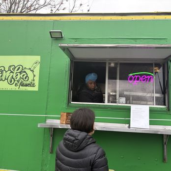 Sambas Cuisine - Laurie ordering at the window. It's a 'no frills' kinda joint! - Food Trucks Near Me Sambas Cuisine - Laurie ordering at the window. It's a 'no frills' kinda joint! - Food Trucks Near Me