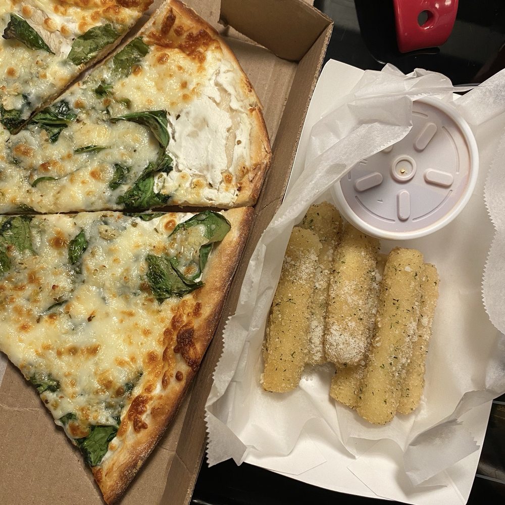 the pizza has a large flour spot and the mozzarella sticks are raw...