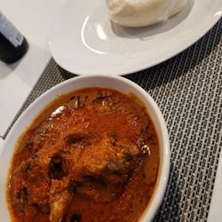 K I African Restaurant - Peanut soup and fufu. Takes a while but worth the wait.