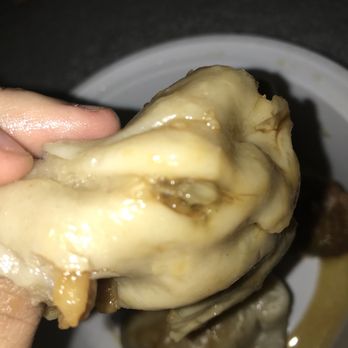 Jade Garden - a hand holding a piece of food - Chinese Near Me - Franklinville, New Jersey