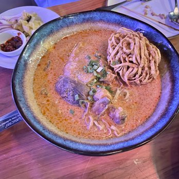 Temsib Eatery & Bar - Kow Soi Chiang Mai- Northern Style egg noodles, slow-cooked chicken quarter in curry served with crispy noodle - Thai Near Me - Bellevue, Washington