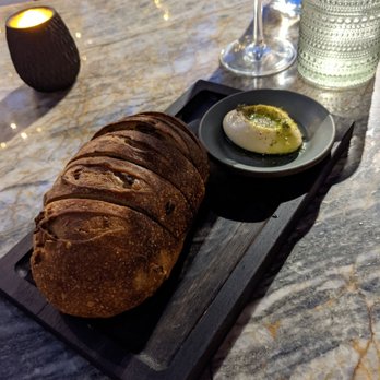 Hazel Hill - Olive sourdough bread and duck fat butter. Yum - New American Near Me - Healdsburg, California