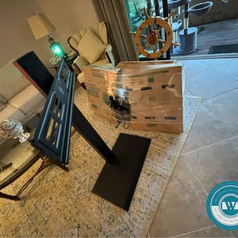We Load and Unload You - Customer did not wont the back to the tv stand taken off, but we still had to wrap it for safety! - Movers Near Me - Jacksonville, Florida We Load and Unload You - Customer did not wont the back to the tv stand taken off, but we still had to wrap it for safety! - Movers Near Me - Jacksonville, Florida