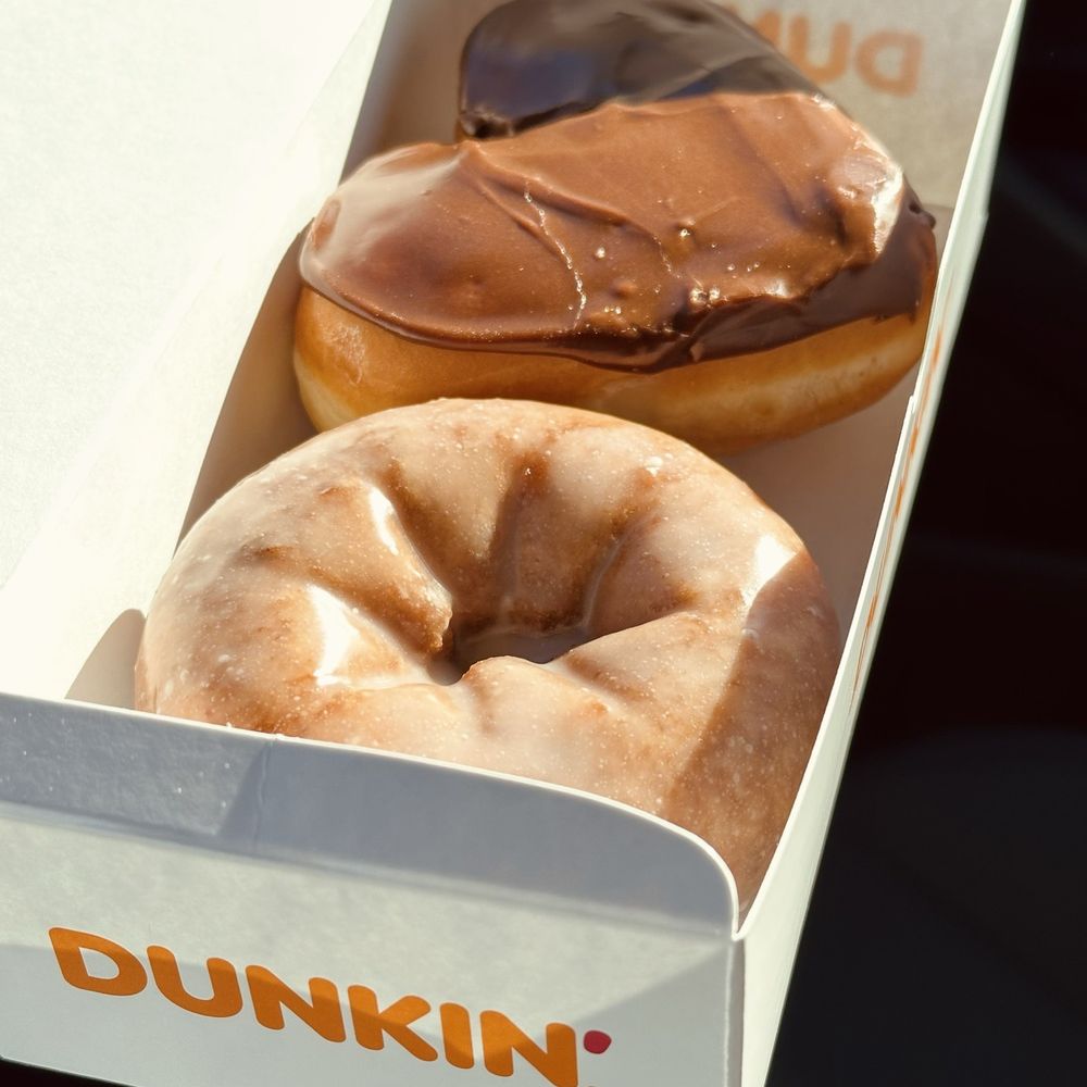 Heart shaped Boston Cream and Blueberry donuts. Heart shaped Boston Cream and Blueberry donuts.