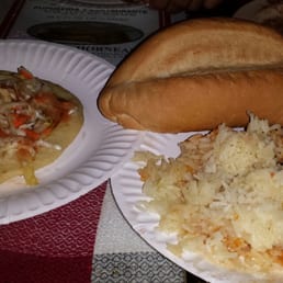 Salvadorian style chicken w/ rice & pupusa. Salvadorian style chicken w/ rice & pupusa.