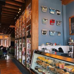 Entrance to the restaurant has a coffee stand and deserts on display