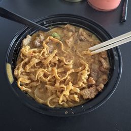 Khao soi with crispy pork belly and filet mignon