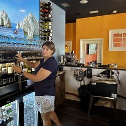 Holy Sh’mokes - Natalie pouring a fine wine