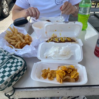 Mad Dogs - Cheese fries, coney dog, veggie dog with Cajun Fritos topped with melted cheese. - Hot Dogs Near Me - Venice, Florida