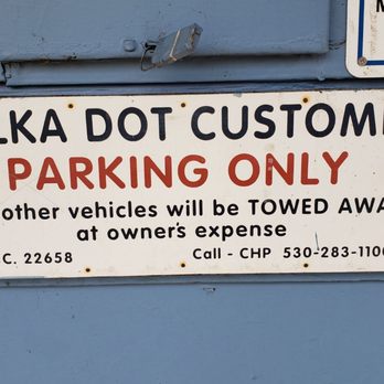 The Polka Dot - a parking only sign on a blue wall - American Near Me - Quincy, California