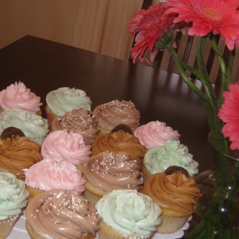 Oh Sue Sweet - a plate of cupcakes and flowers - Desserts Near Me Oh Sue Sweet - a plate of cupcakes and flowers - Desserts Near Me