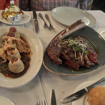 Le Moo - Le Moo Sliced Baked Potato, Le Moo Wagyu Pigs in a Blanket, Tomahawk Ribeye (32-Oz.), Fried Grits Cakes - Steakhouses Near Me - Louisville, Kentucky Le Moo - Le Moo Sliced Baked Potato, Le Moo Wagyu Pigs in a Blanket, Tomahawk Ribeye (32-Oz.), Fried Grits Cakes - Steakhouses Near Me - Louisville, Kentucky