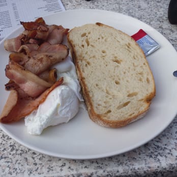 Kuta Cafe - Poached egg, bacon and sourdough. Yum - Restaurants Near Me - Mount Coot-tha, QLD