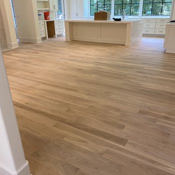 MLC Flooring - a view of a kitchen and living room - Flooring Near Me MLC Flooring - a view of a kitchen and living room - Flooring Near Me