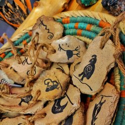 Horse Feathers Gallery - Clay Ornaments with petroglyph designs from our local ceramic artist.