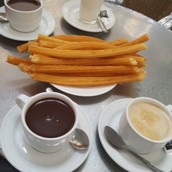 Chocolatería San Ginés - Latte, churros, chocolate dipping, and a glass of milk - Chocolatiers & Shops Near Me - Madrid, M